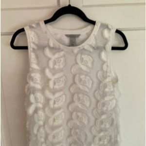 Sheer overlay with appliqués over white tank